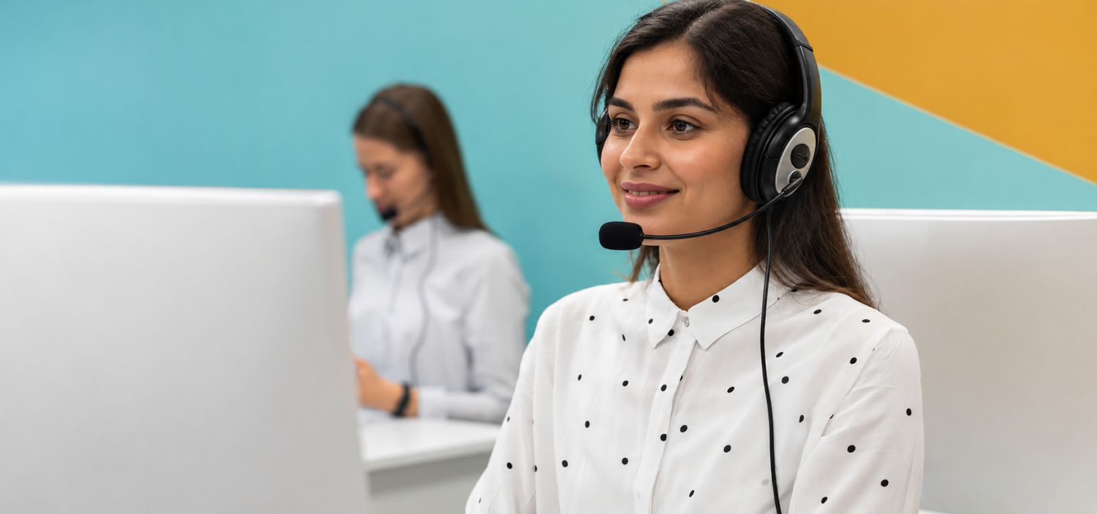 Illustrative image: a support specialist with a headset.